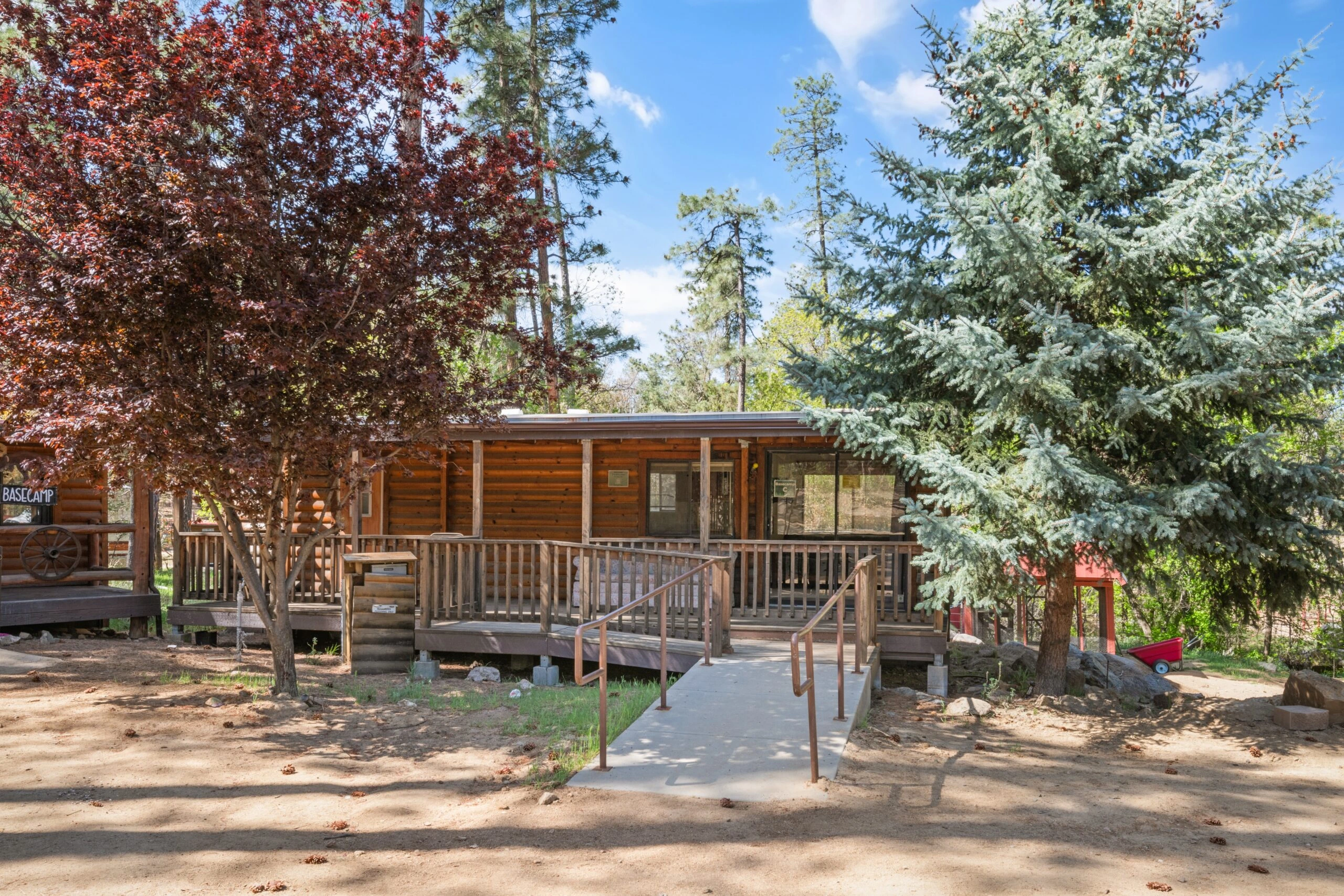 a house with a walkway and trees