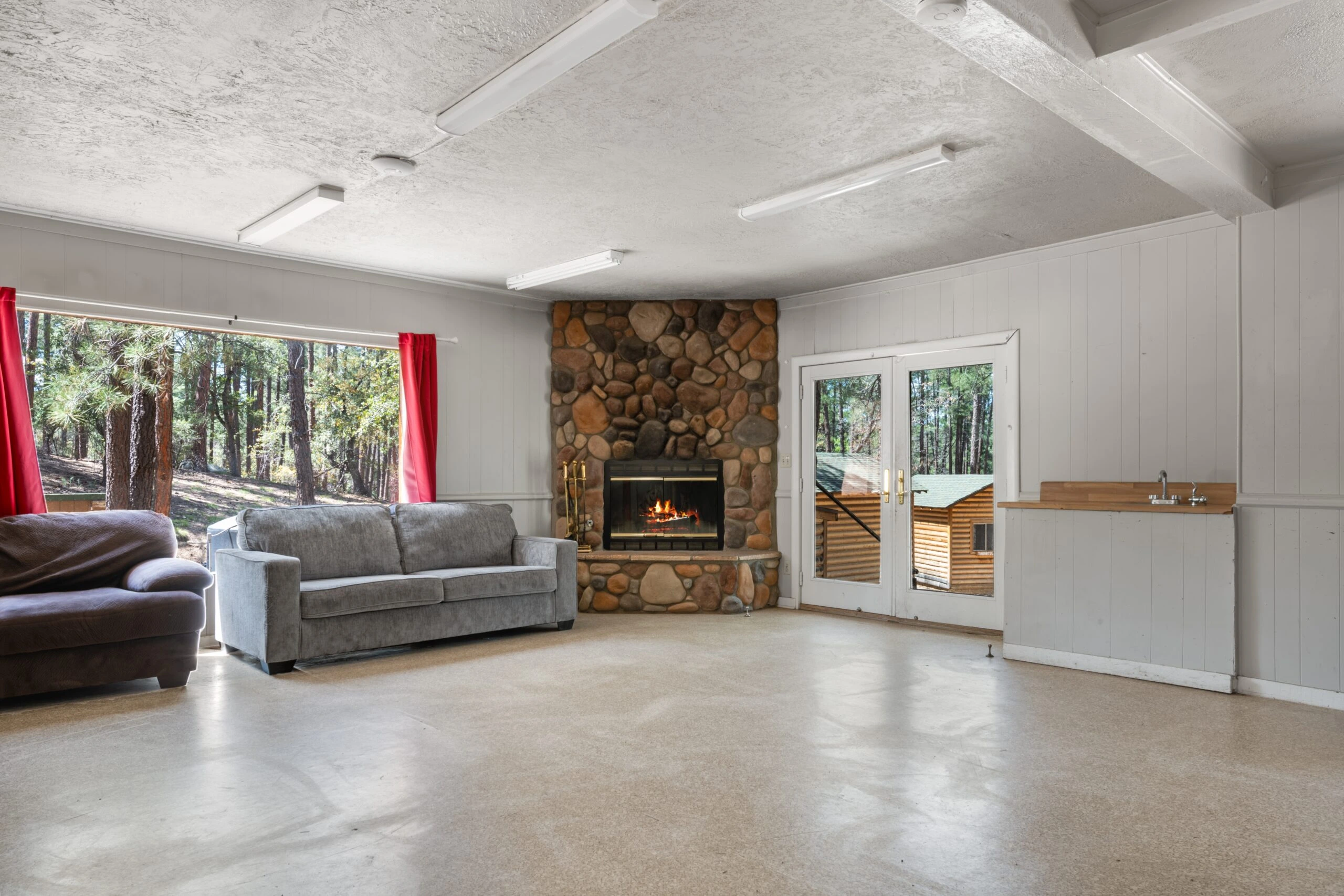 a living room with a fireplace and a couch