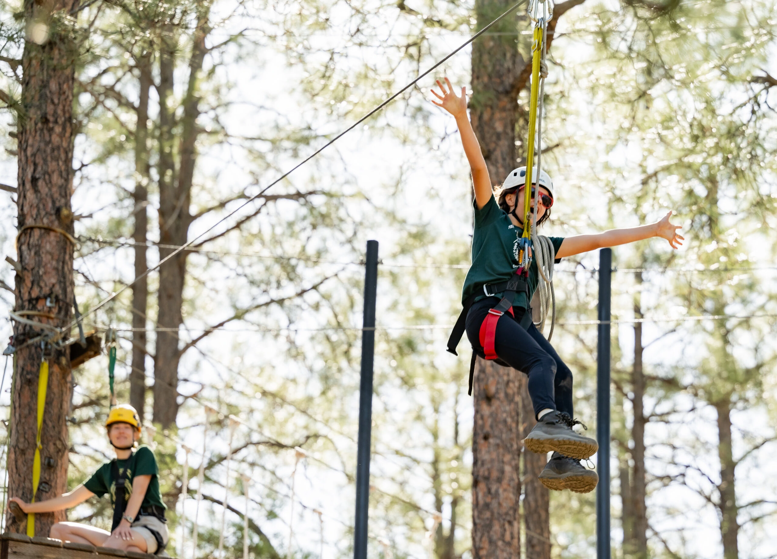 a girl in a harness and helmet