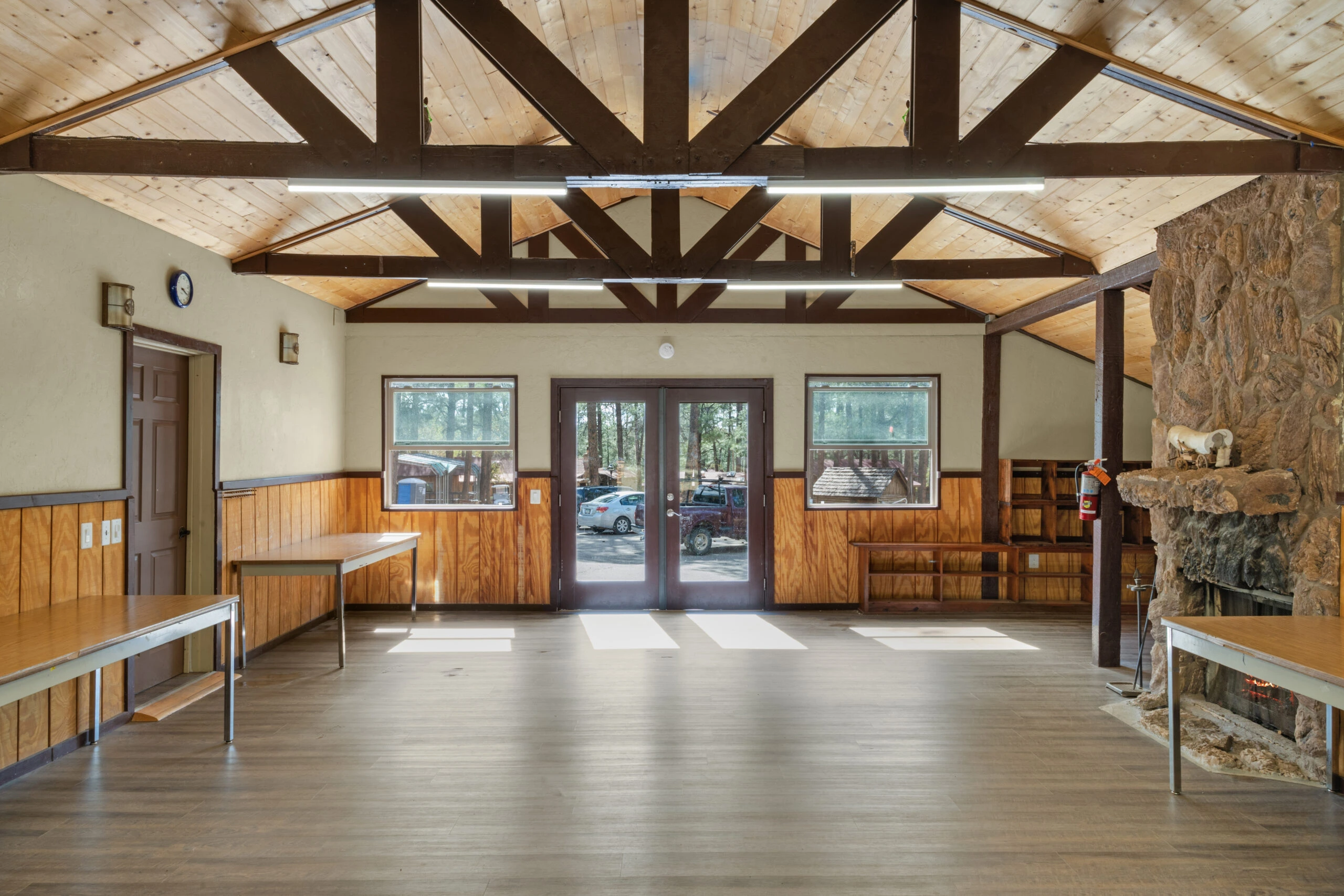 a room with wood beams and a wood floor