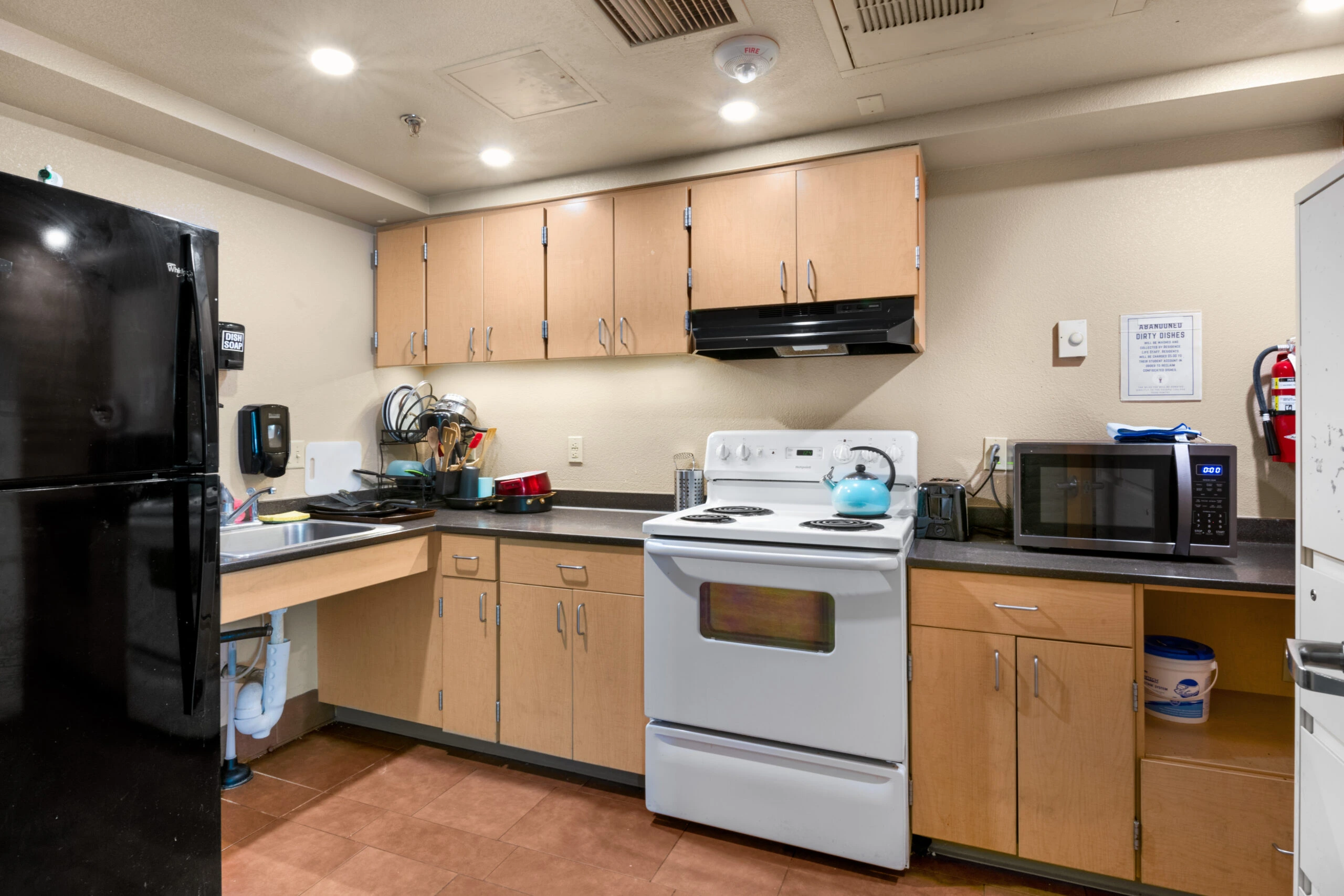 a kitchen with a stove and microwave