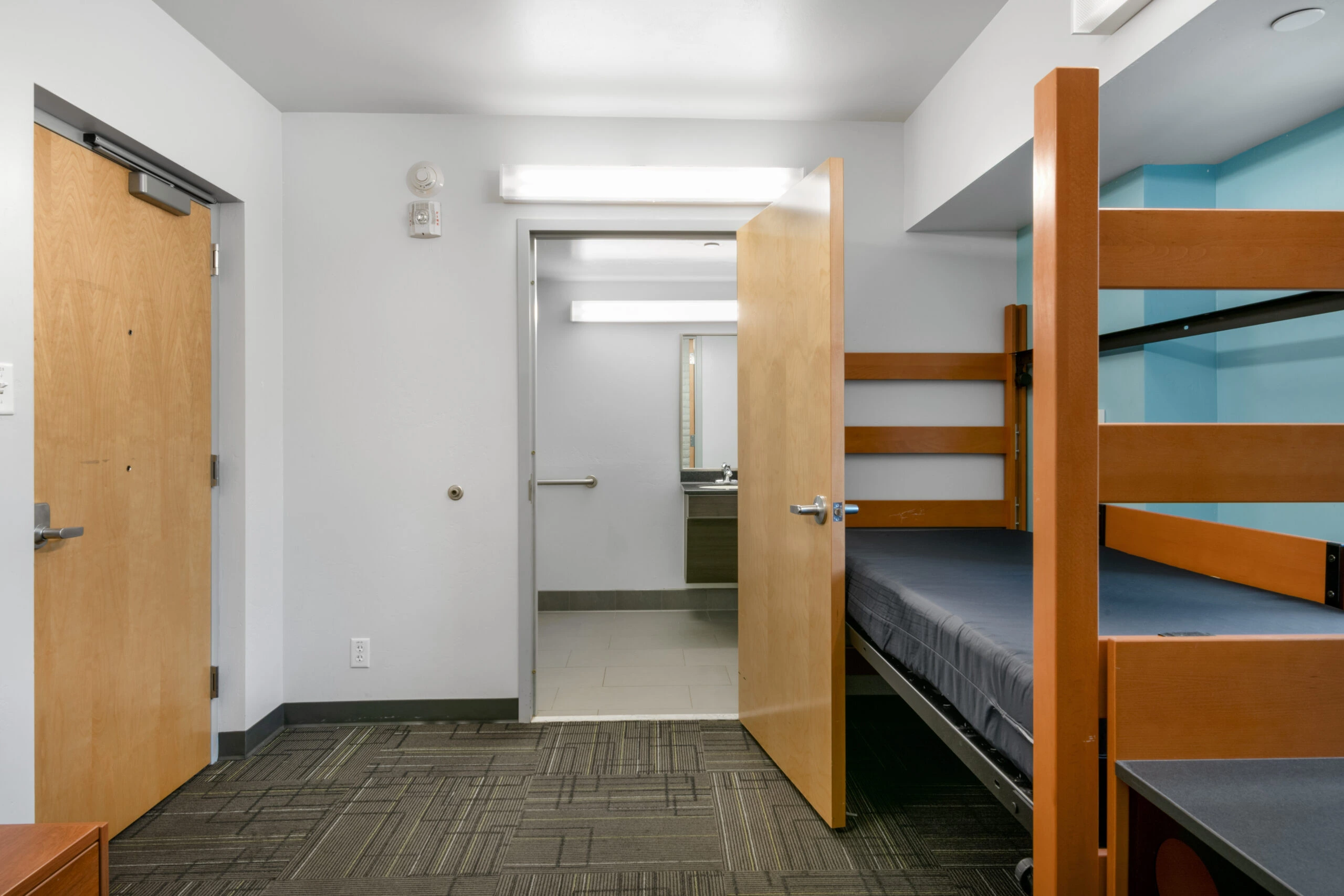 a room with a bed and a door