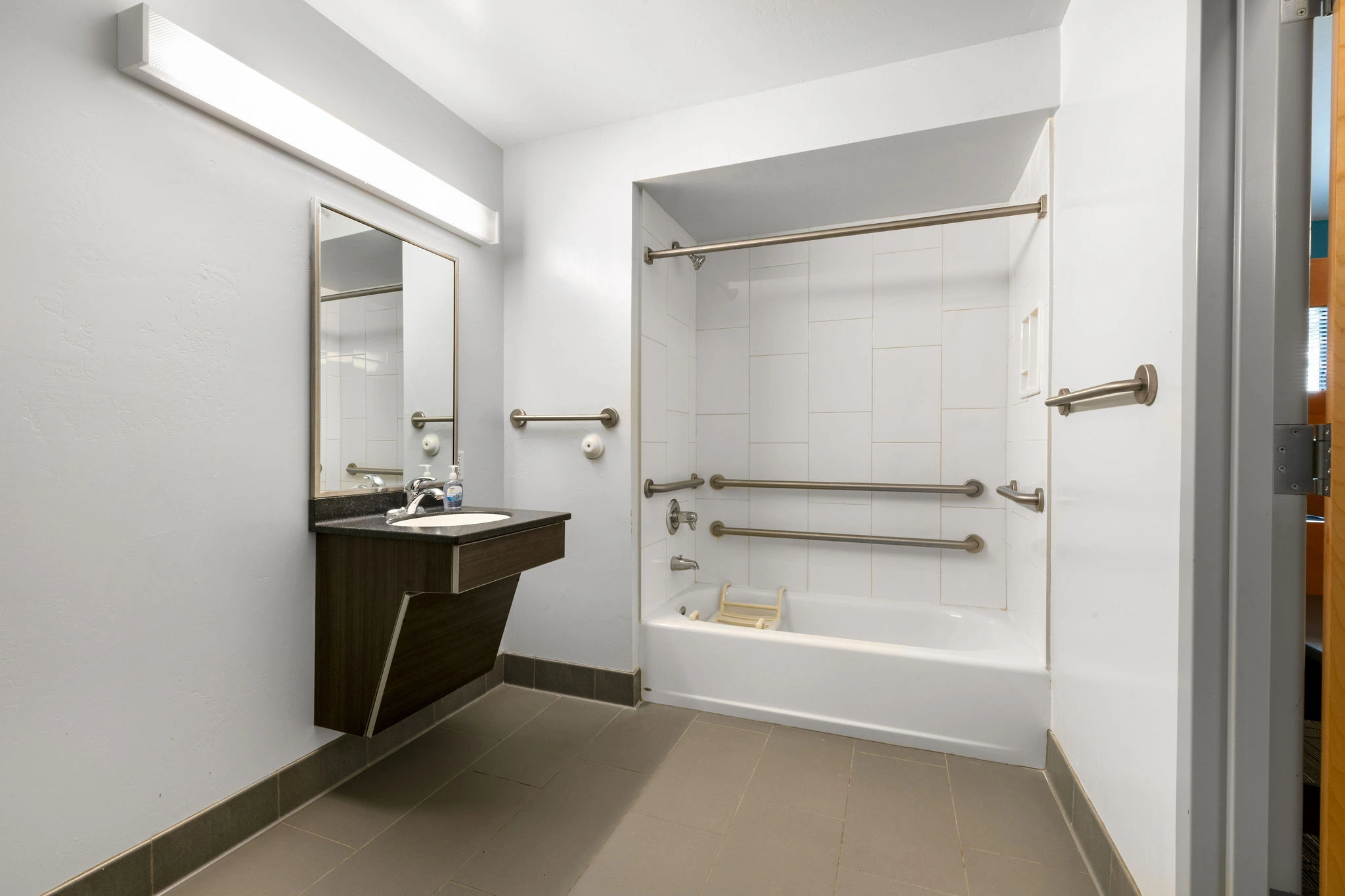 a bathroom with a sink and shower
