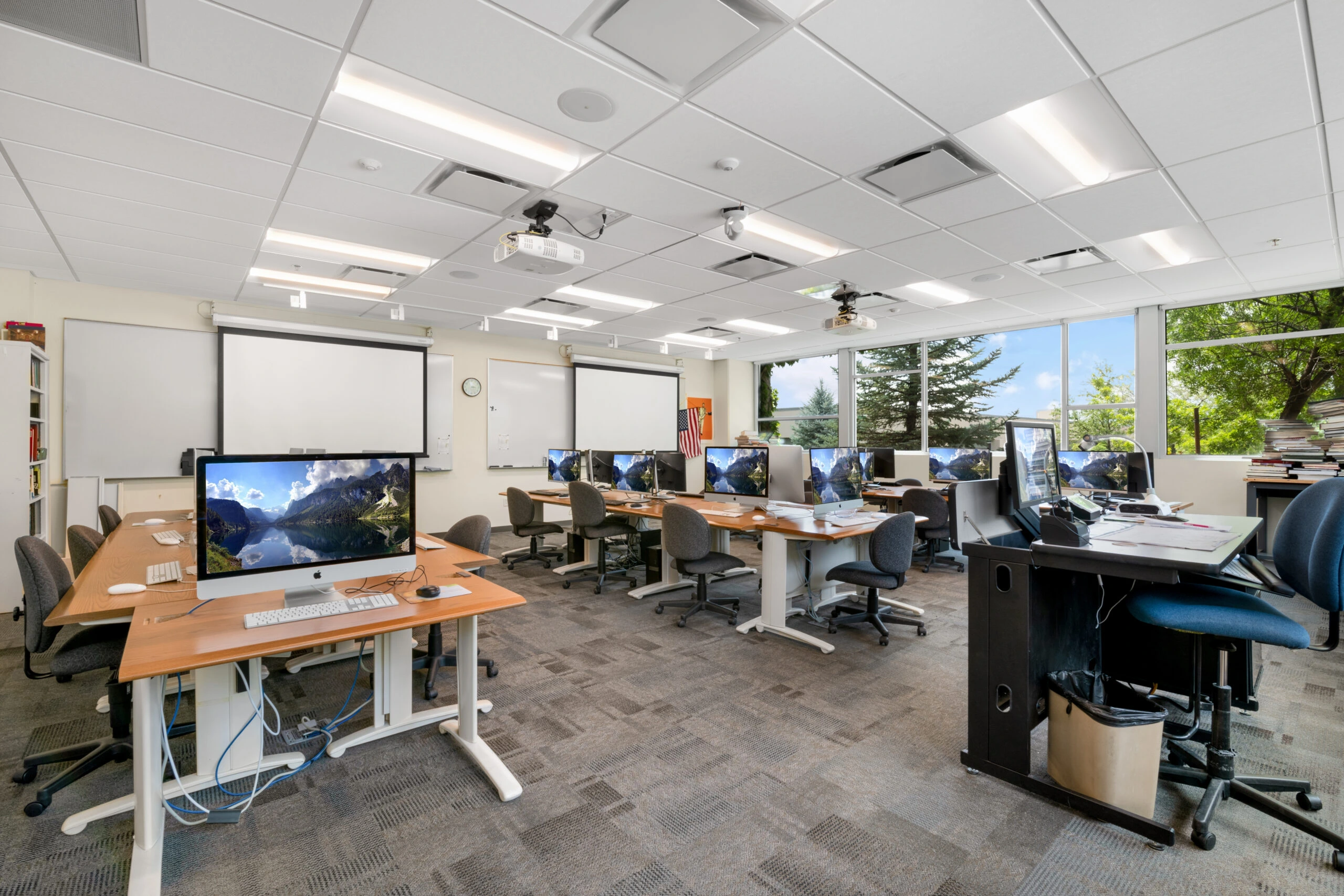 a room with computers and whiteboards