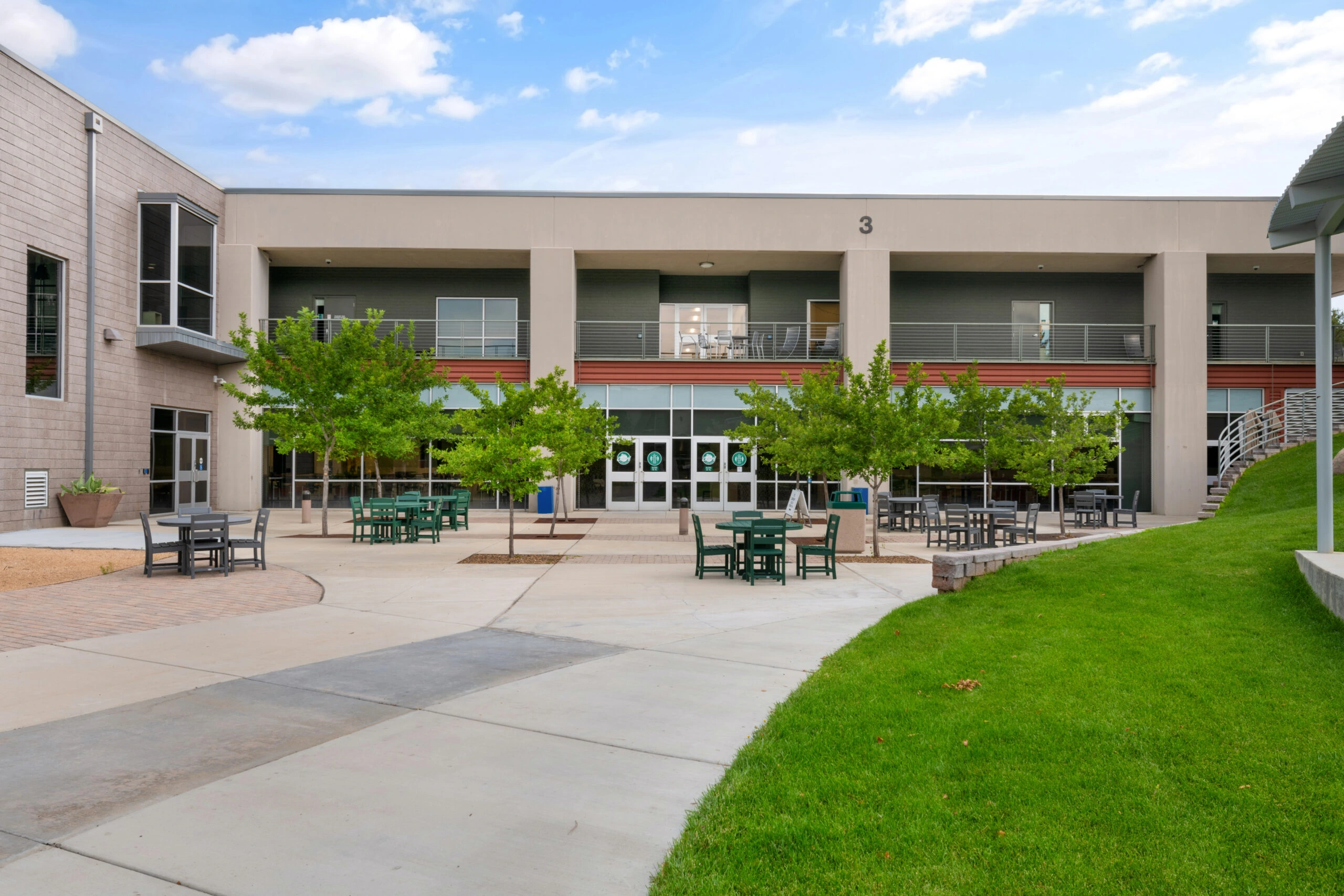 a building with tables and chairs outside