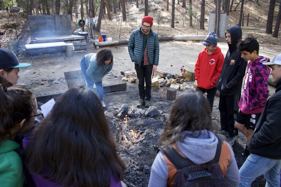 a group of people around a fire