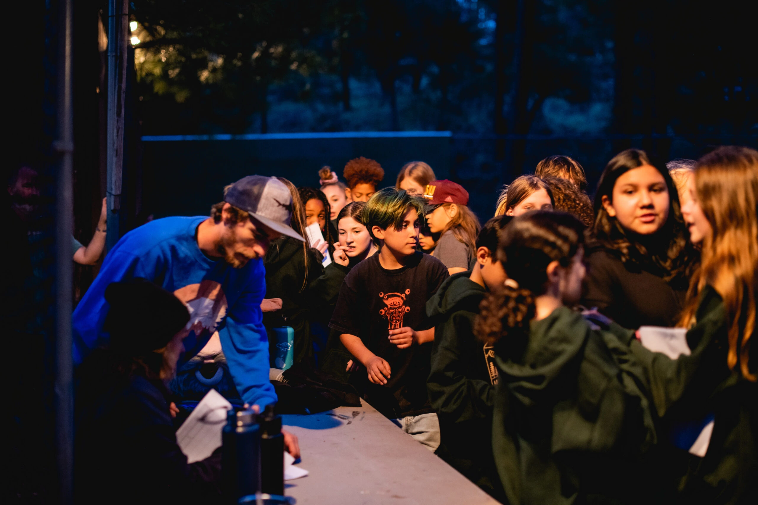 a group of people sitting around a table