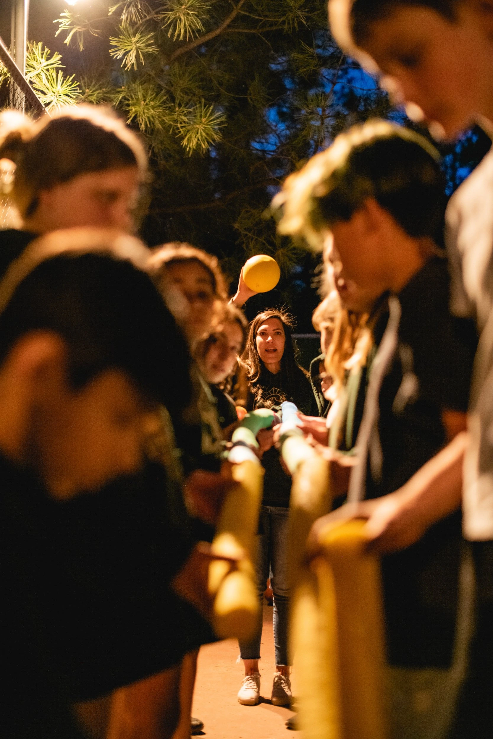 a group of people playing with a rope