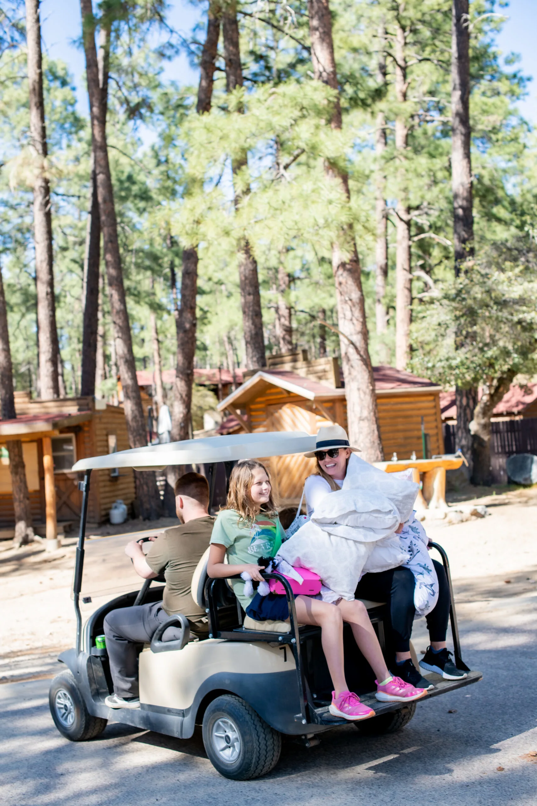 a group of people in a golf cart