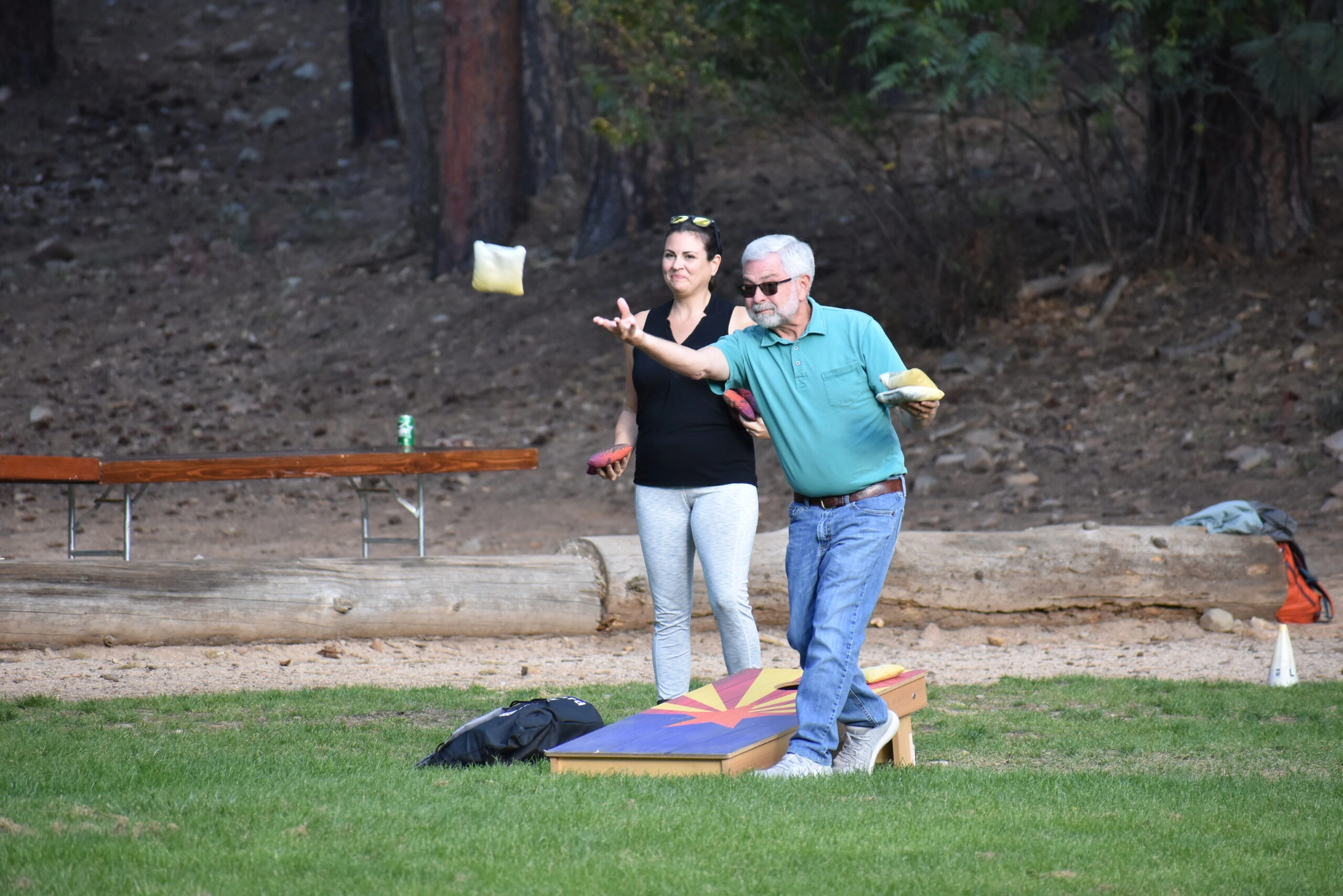 a man and woman throwing food in the air