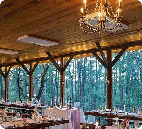 a room with tables and chairs and a chandelier