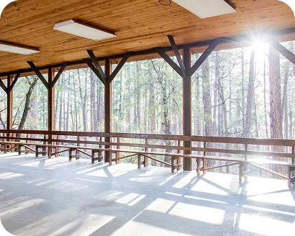 a sun shining through the windows of a building