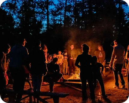 a group of people around a fire